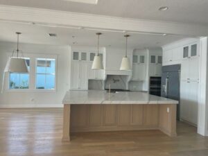 White themed kitchen, counter table and lights